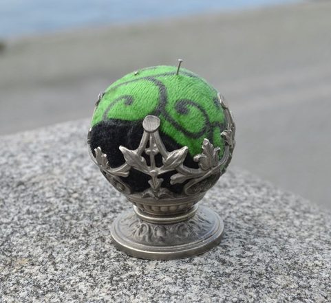 HISTORICAL PINCUSHION, TIN