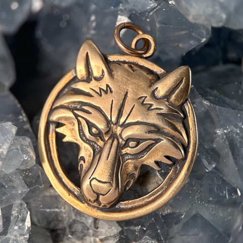 WOLF'S HEAD IN A RING, BRONZE PENDANT