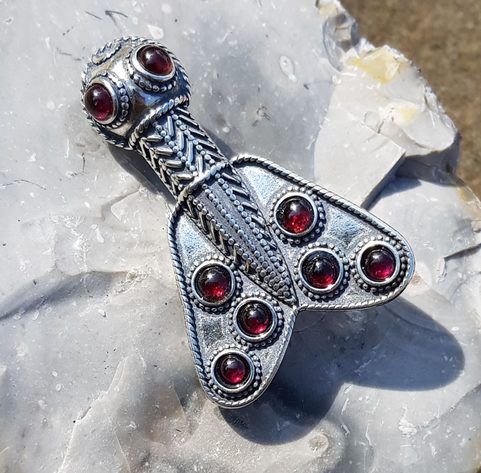 MEROVINGIAN SILVER AND GARNET CICADA BROOCH, 5TH CENTURY