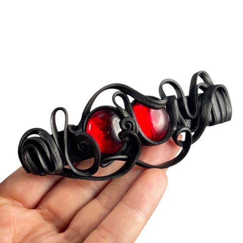 FERMOIR POUR CHEVEUX AUX YEUX ROUGES