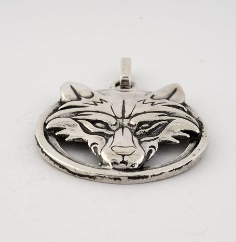 WOLF'S HEAD IN A RING, STERLING SILVER PENDANT