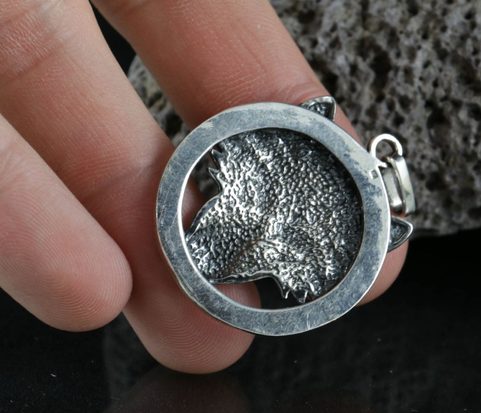 WOLF'S HEAD IN A RING, STERLING SILVER PENDANT