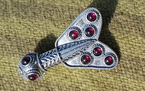 MEROVINGIAN SILVER AND GARNET CICADA BROOCH, 5TH CENTURY