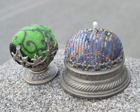 HISTORICAL PINCUSHION, TIN