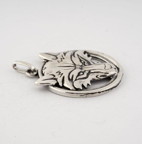 WOLF'S HEAD IN A RING, STERLING SILVER PENDANT