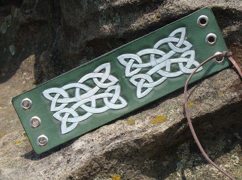 WALGANUS, LACED LEATHER CUFF, HAND CARVED