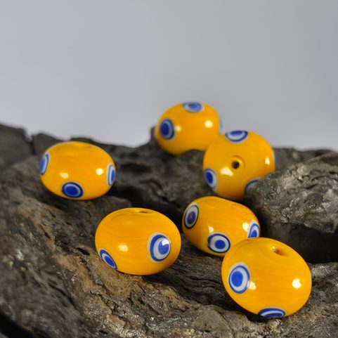 CELTIC GLASS BEAD WITH EYES, YELLOW