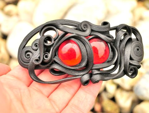 RED EYED HAIR CLASP