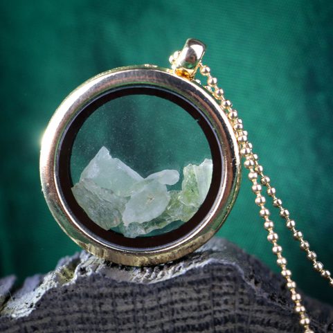 MOLDAVITE STEEL FLOATING LOCKET, GOLD COL.