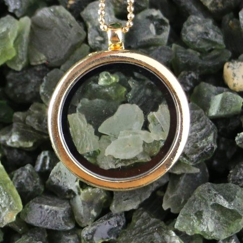 MOLDAVITE STEEL FLOATING LOCKET, GOLD COL.
