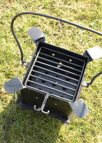 HISTORIC PORTABLE FIREPLACE AND GRILL MADE OF STEEL