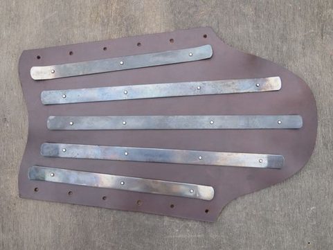 LEATHER GREAVES WITH STEEL STRIPS, PRICE FOR THE PAIR