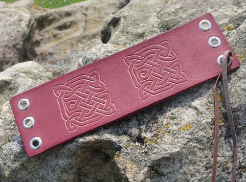 GORT, LACED LEATHER CUFF, HAND CARVED