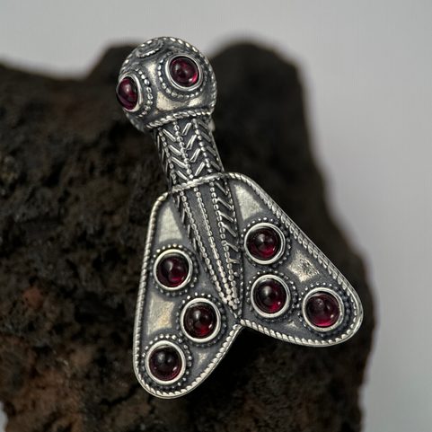 MEROVINGIAN SILVER AND GARNET CICADA BROOCH, 5TH CENTURY
