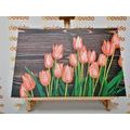 CANVAS PRINT CHARMING ORANGE TULIPS ON A WOODEN BACKGROUND - PICTURES FLOWERS - PICTURES