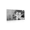 CANVAS PRINT STATUES OF ANGELS ON A BENCH IN BLACK AND WHITE - BLACK AND WHITE PICTURES - PICTURES