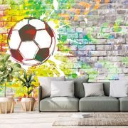 Samoprzylepna tapeta zwycięska piłka na ceglanej ścianie