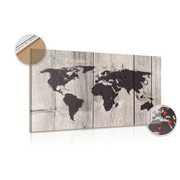 Picture on cork map on wooden background