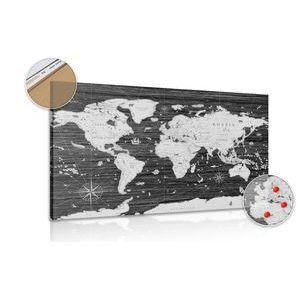 Wandbild auf Kork Schwarz-weiße Weltkarte auf hölzernem Hintergrund