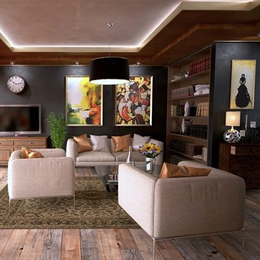 obývačka s hnedými koženými sedačkami a abstraktným umením
