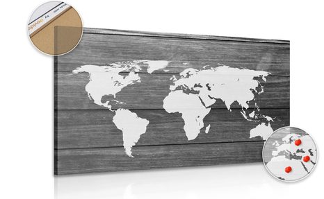 PICTURE OF A BLACK & WHITE WORLD MAP CORK WITH A WOODEN BACKGROUND