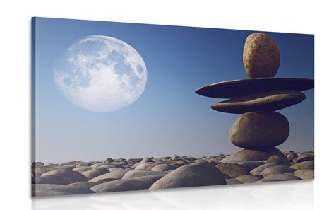 PICTURE OF STACKED STONES IN THE MOONLIGHT