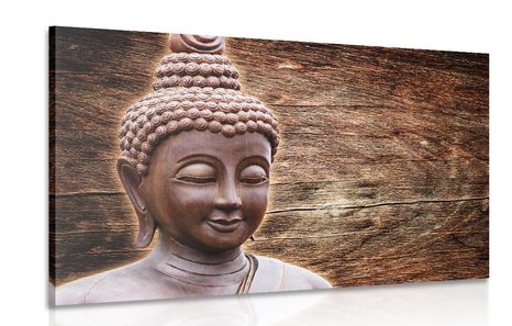 WANDBILD BUDDHA-STATUE AUF HÖLZERNEM HINTERGRUND - BILDER MIT FENG SHUI-MOTIVEN - BILDER