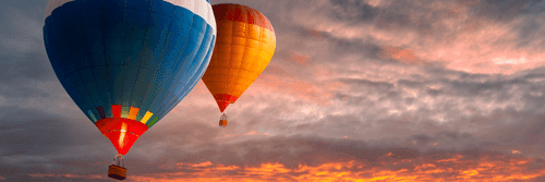 WANDBILD FLIEGENDE BALLONS ÜBER DEN BERGEN - STILLLEBEN-BILDER - BILDER