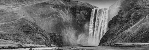 WANDBILD IKONISCHER WASSERFALL IN ISLAND IN SCHWARZ-WEISS - SCHWARZ-WEISSE BILDER - BILDER