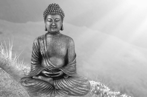 WANDBILD BUDDHA-STATUE IN MEDITIERENDER POSITION IN SCHWARZ-WEISS - SCHWARZ-WEISSE BILDER - BILDER