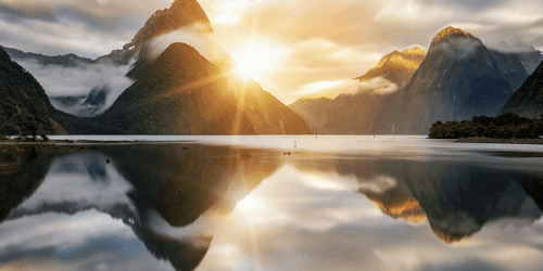 WANDBILD MILFORD SOUND BEIM SONNENAUFGANG - BILDER VON NATUR UND LANDSCHAFT - BILDER