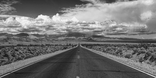 CANVAS PRINT BLACK AND WHITE ROAD IN THE DESERT - BLACK AND WHITE PICTURES - PICTURES