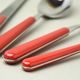 24 pcs. cutlery set, Tinta Unita, brick red, NEVA