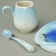 Playful penguins design sculptured porcelain cup and saucer + spoon, FRANZ Porcelain