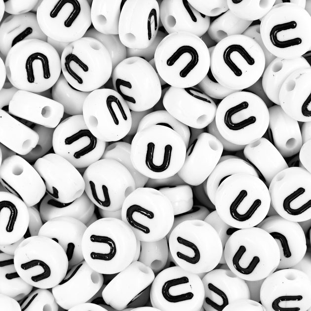 White mix of plastic beads 7x5 mm with letters