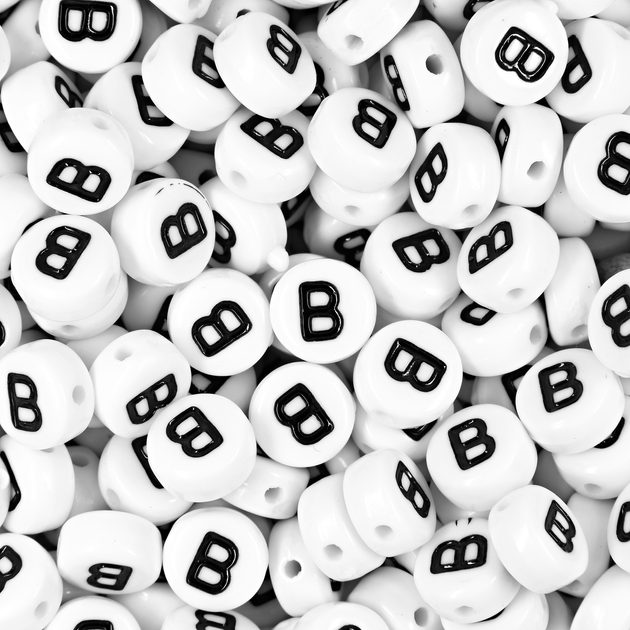 White mix of plastic beads 7x5 mm with letters