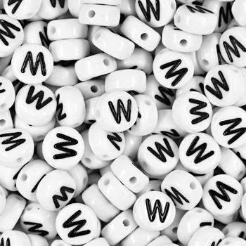 White plastic bead 7x4 mm with letter W