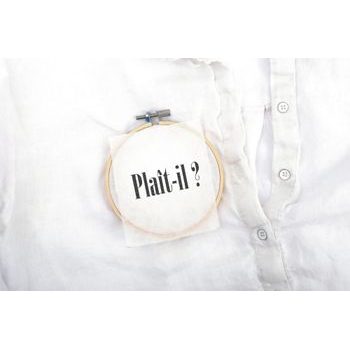Kit for embroidering a table-cloth with a coffee design