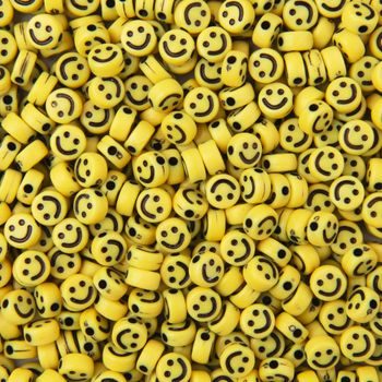Yellow plastic beads with Emojis