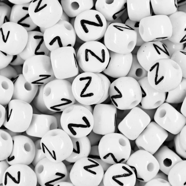 White plastic bead 7x5 mm with letter Z