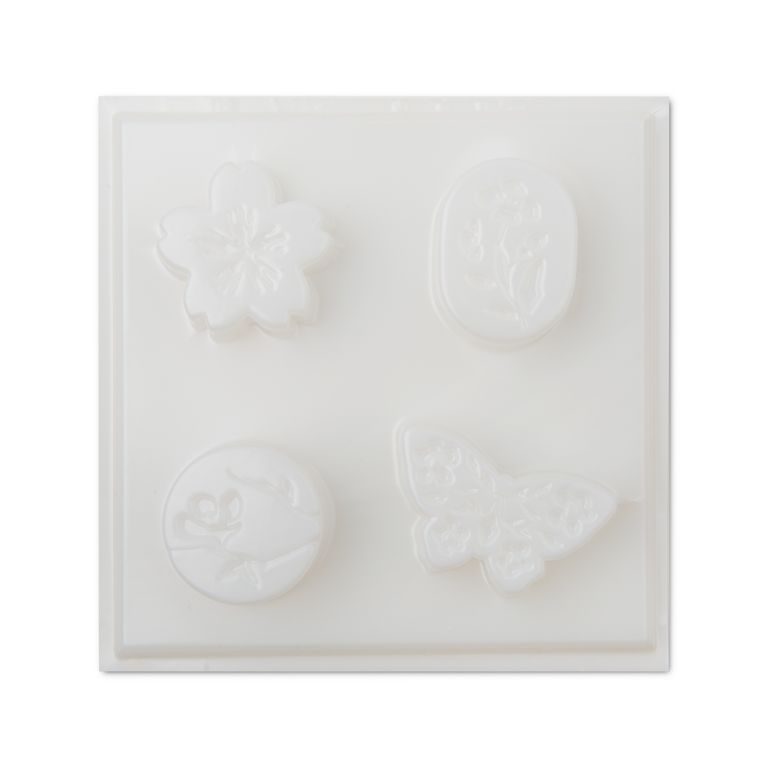 Plastic mould for casting scented wax melts with 4 shapes
