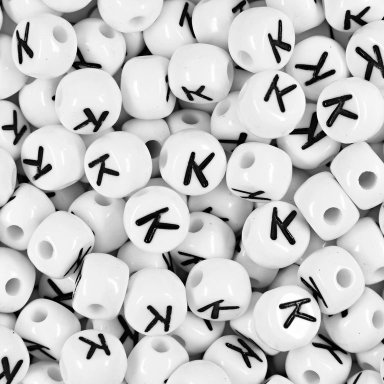 White plastic bead 7x5 mm with letter K