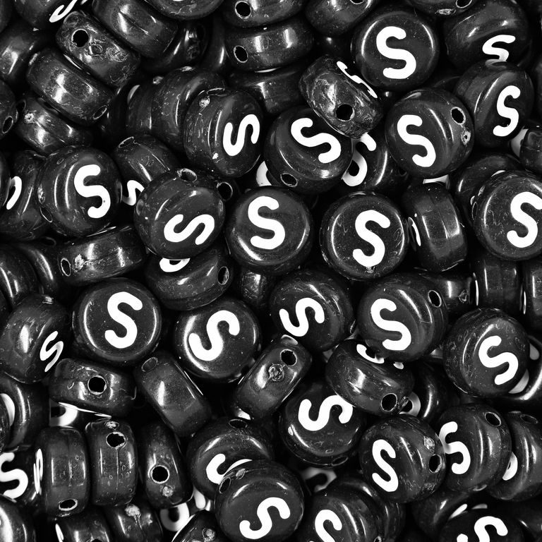 Black plastic bead 7x4 mm with letter S