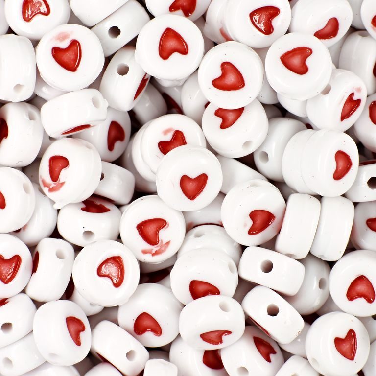 White plastic bead 7x4 mm with heart