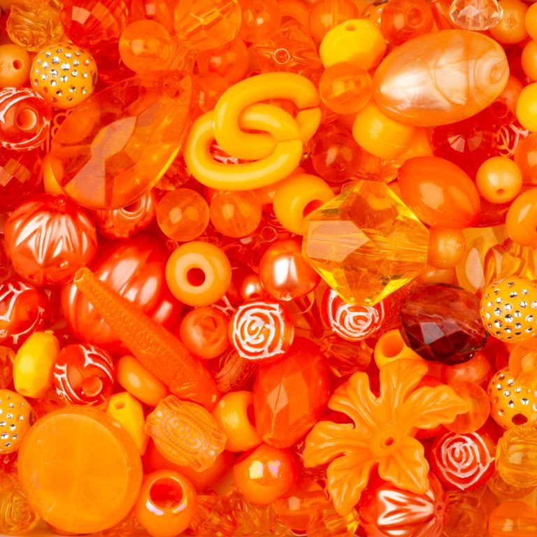 Mix of plastic beads orange