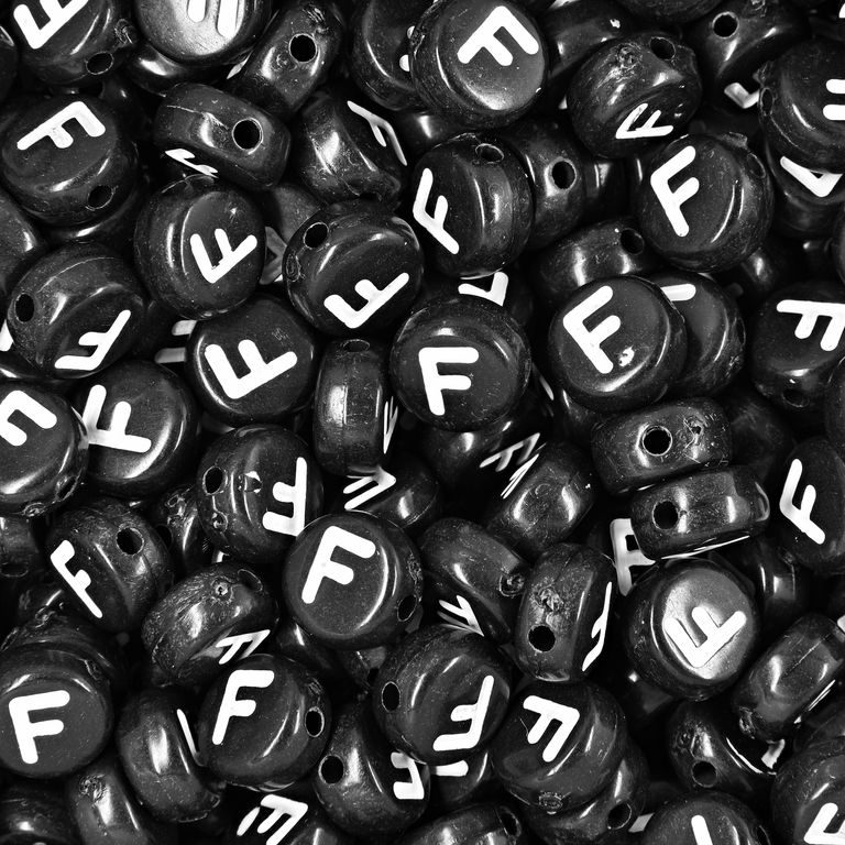 Black plastic bead 7x4 mm with letter F
