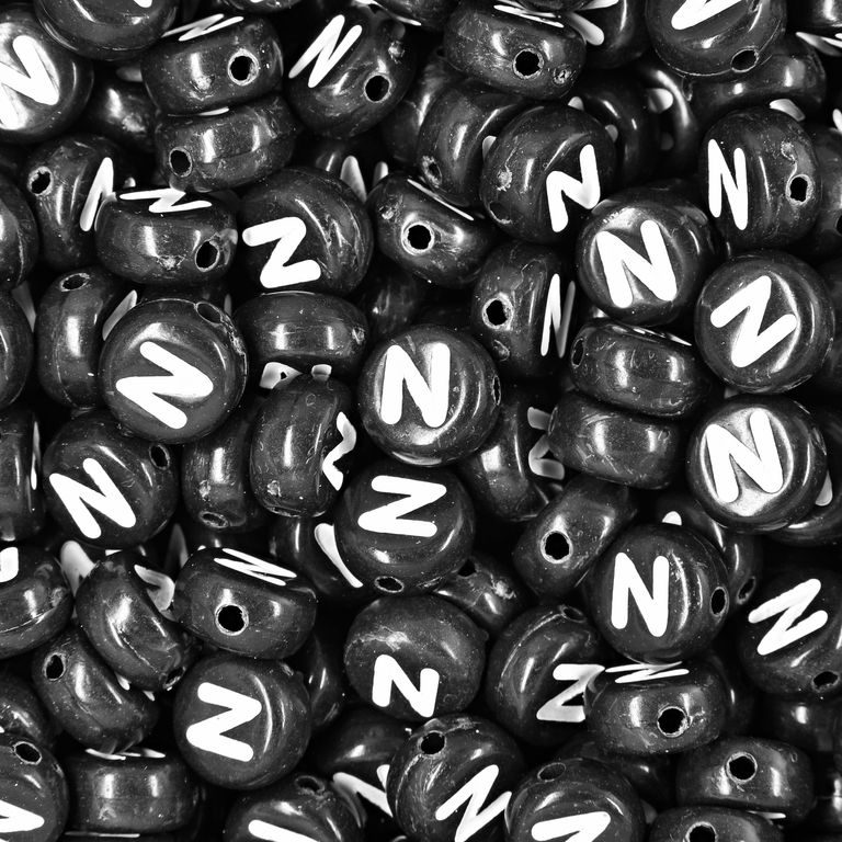 Black plastic bead 7x4 mm with letter N