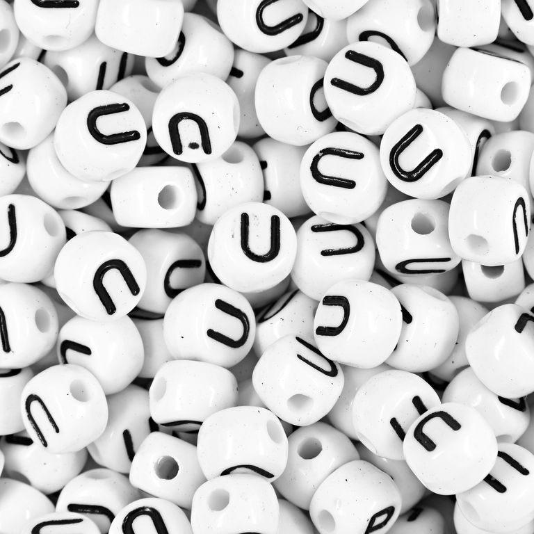 White plastic bead 7x5 mm with letter U