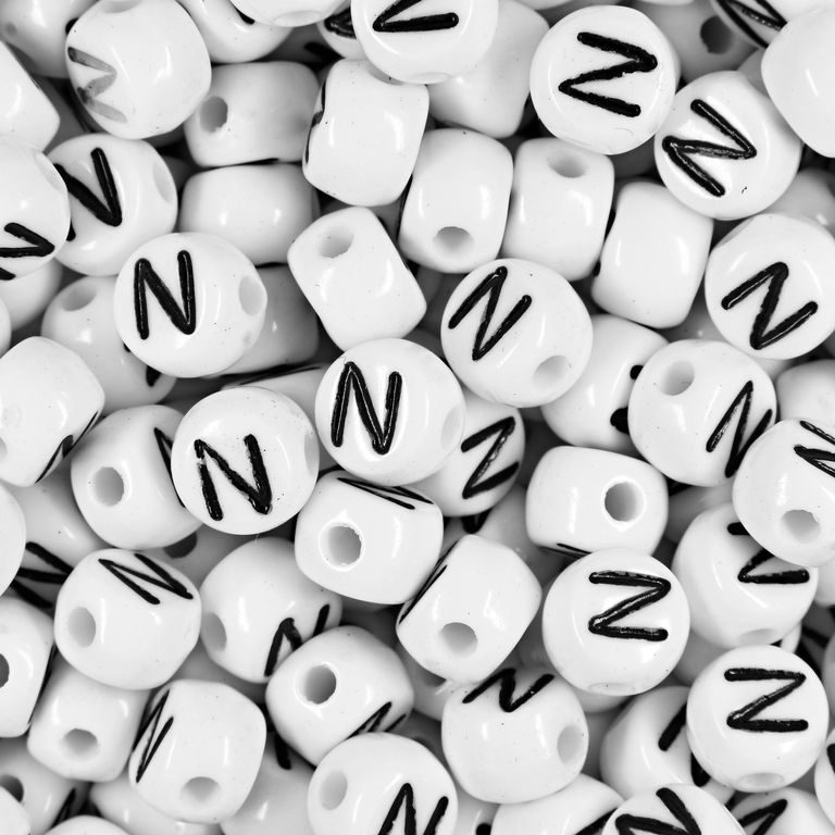 White plastic bead 7x5 mm with letter N