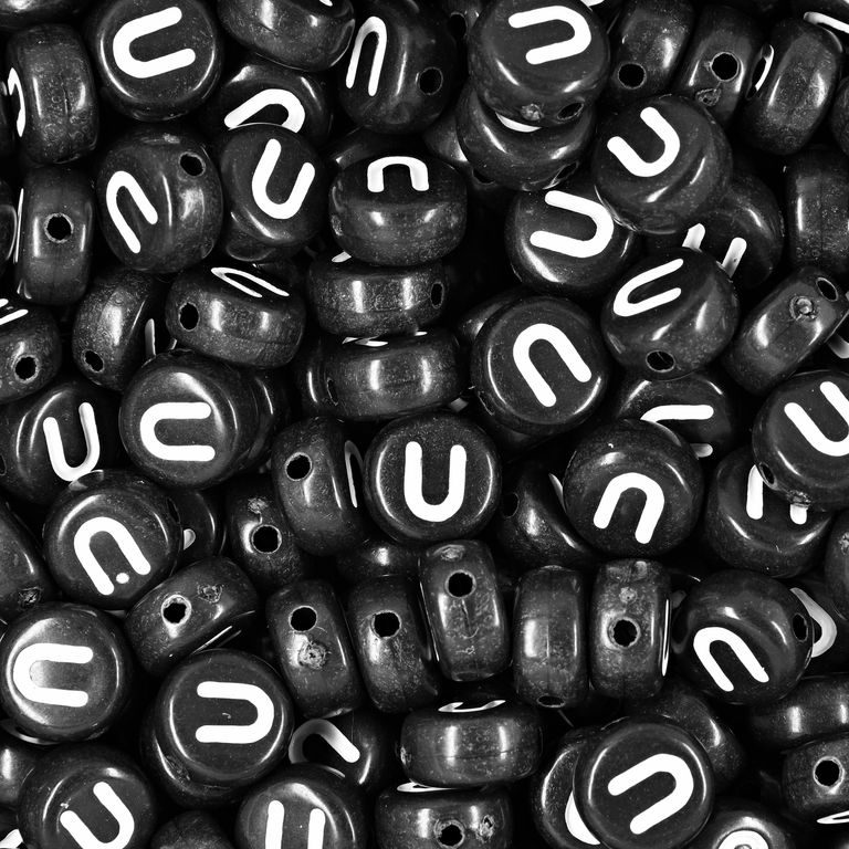 Black plastic bead 7x4 mm with letter U
